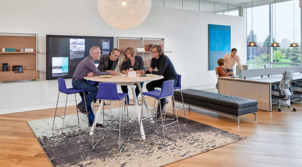 employees collaborating in an open office space