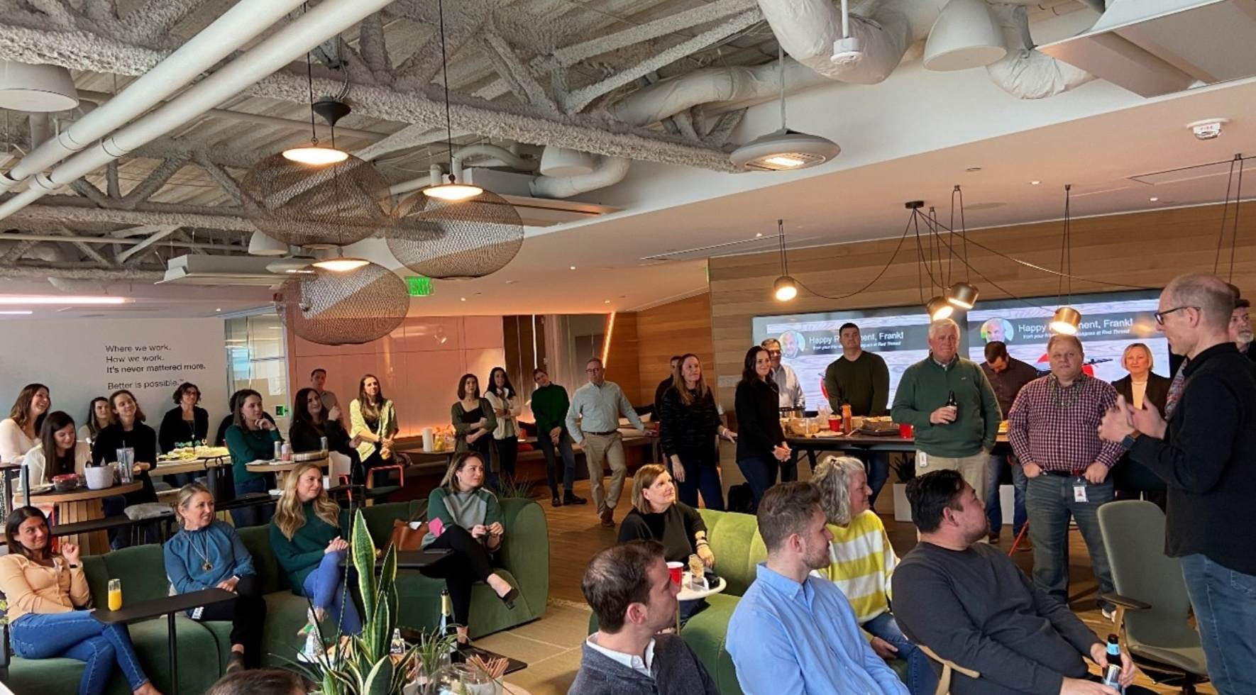 a group of hybrid workers in a work cafe